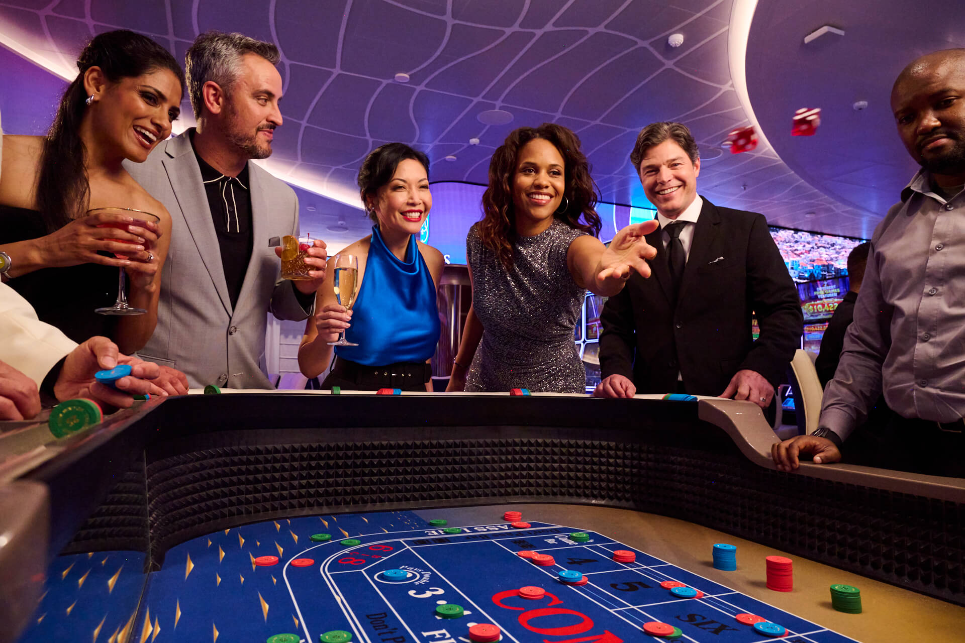 Woman playing dice at a gaming table.